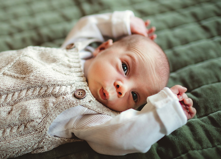 Baby with funny expression portrait taken by Philadelphia newborn photographer