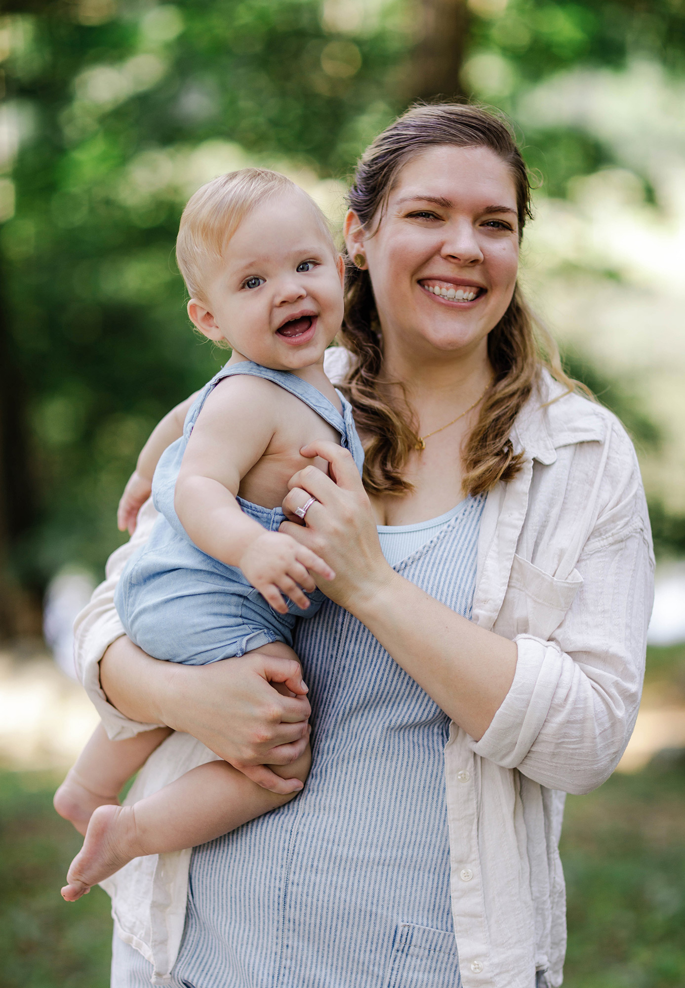 mom holding happy baby