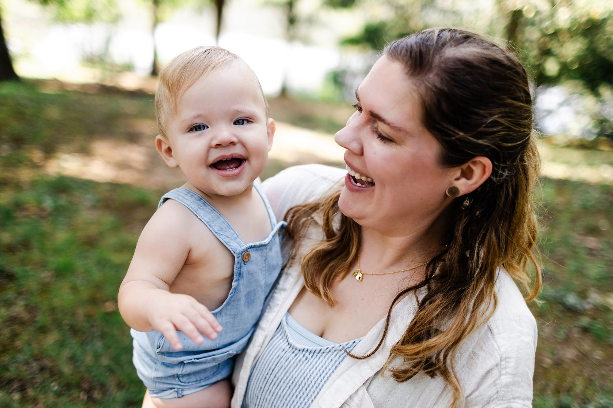 mom holding happy baby