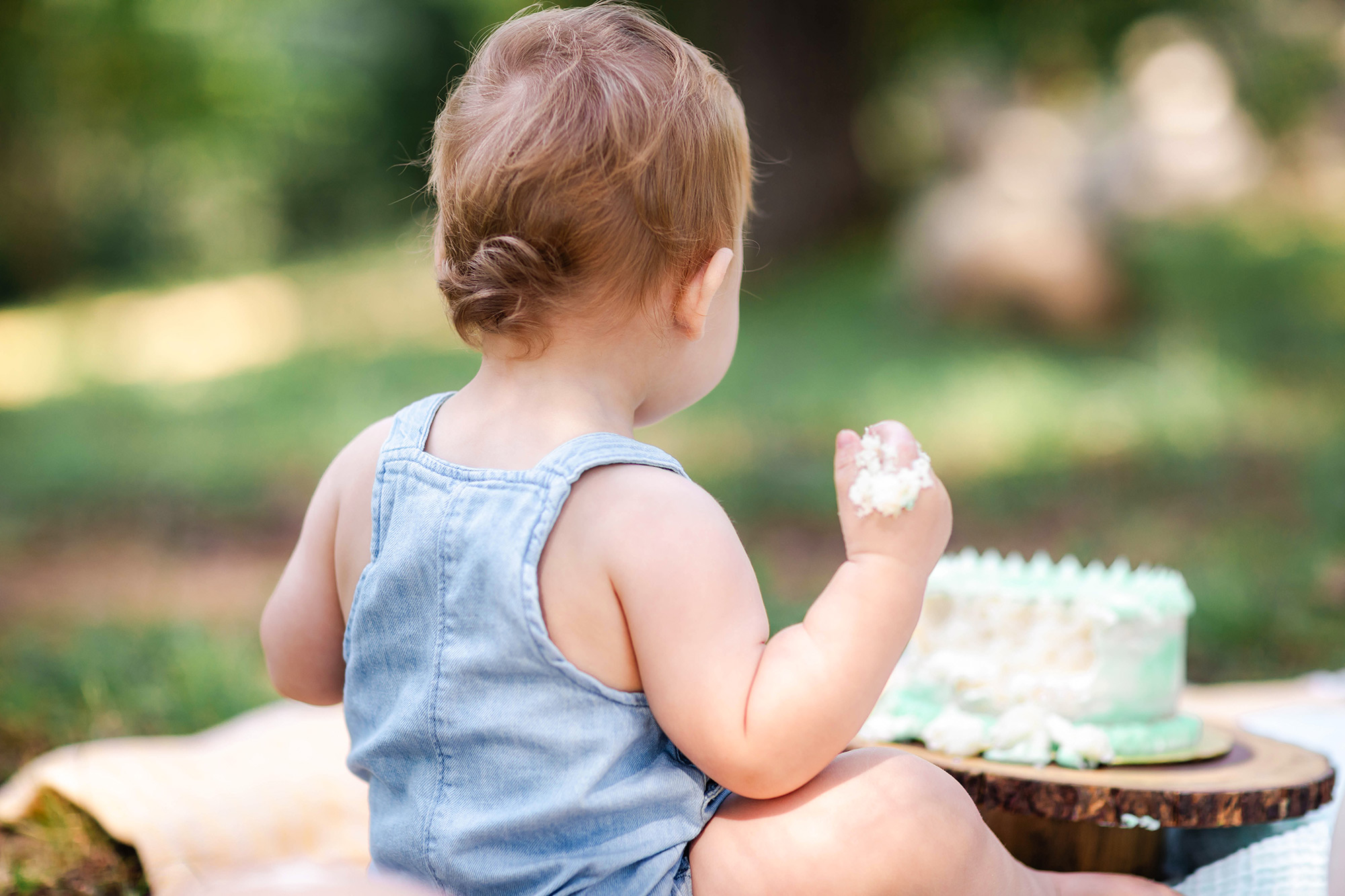 back of baby's head showing off his hair curl