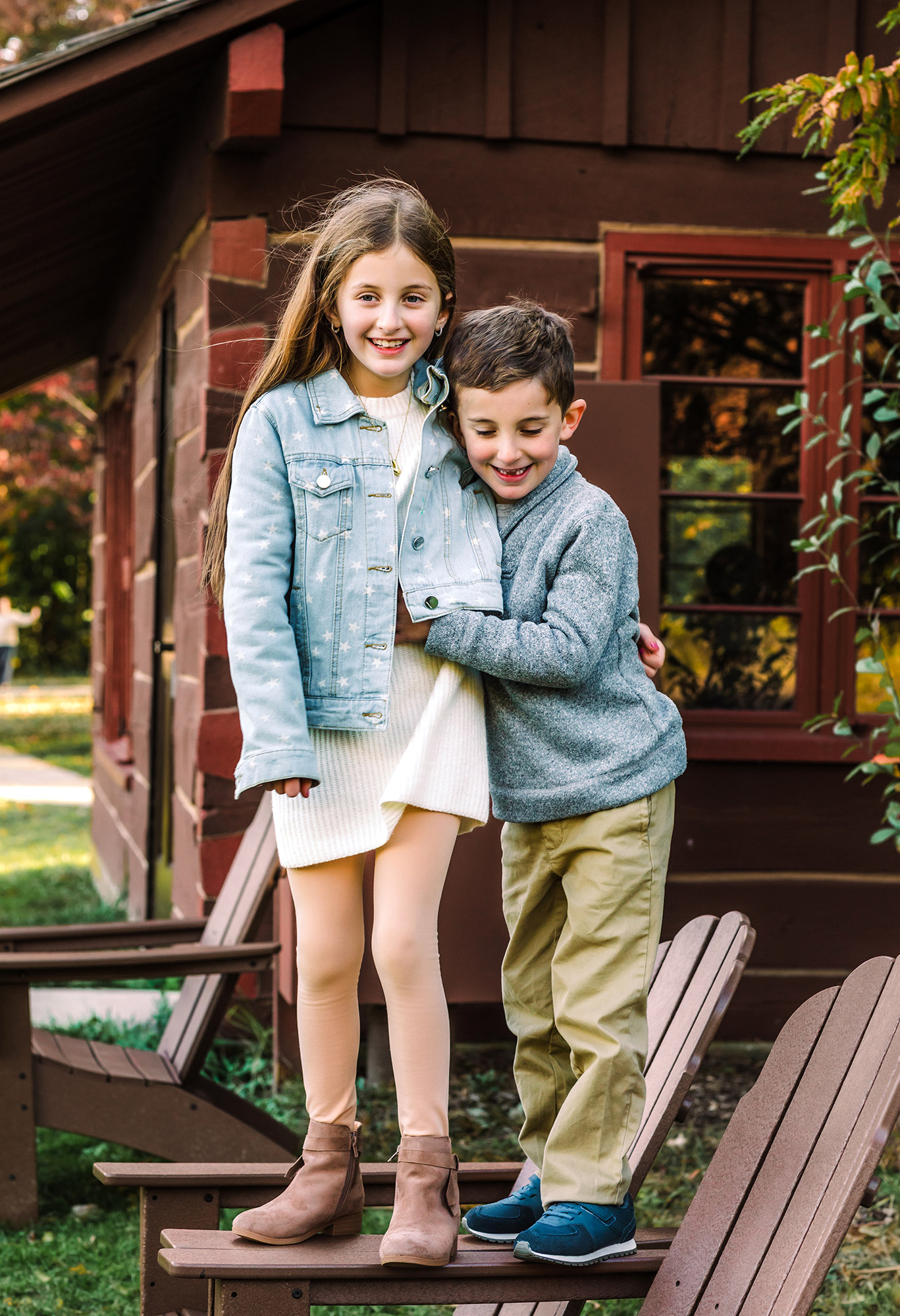 sister and little brother hugging