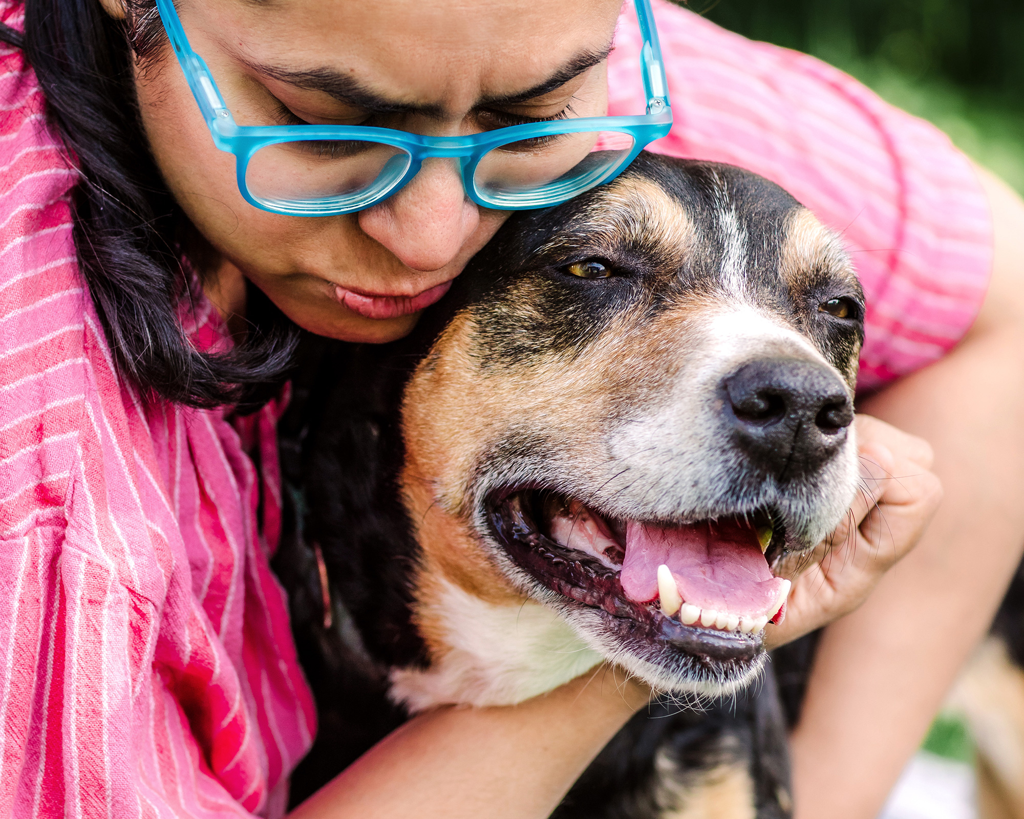 dog mom hugging her dog goodbye