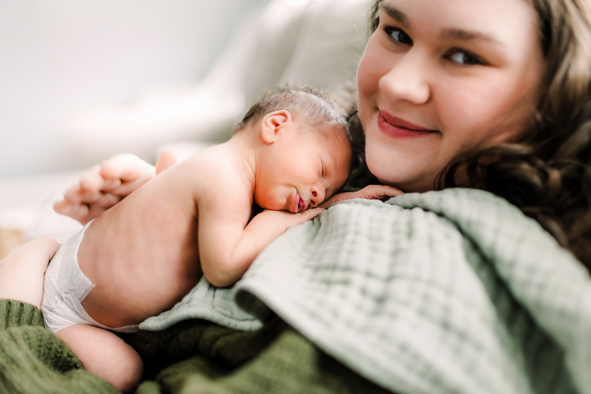 Newborn sleeping on mom's chest