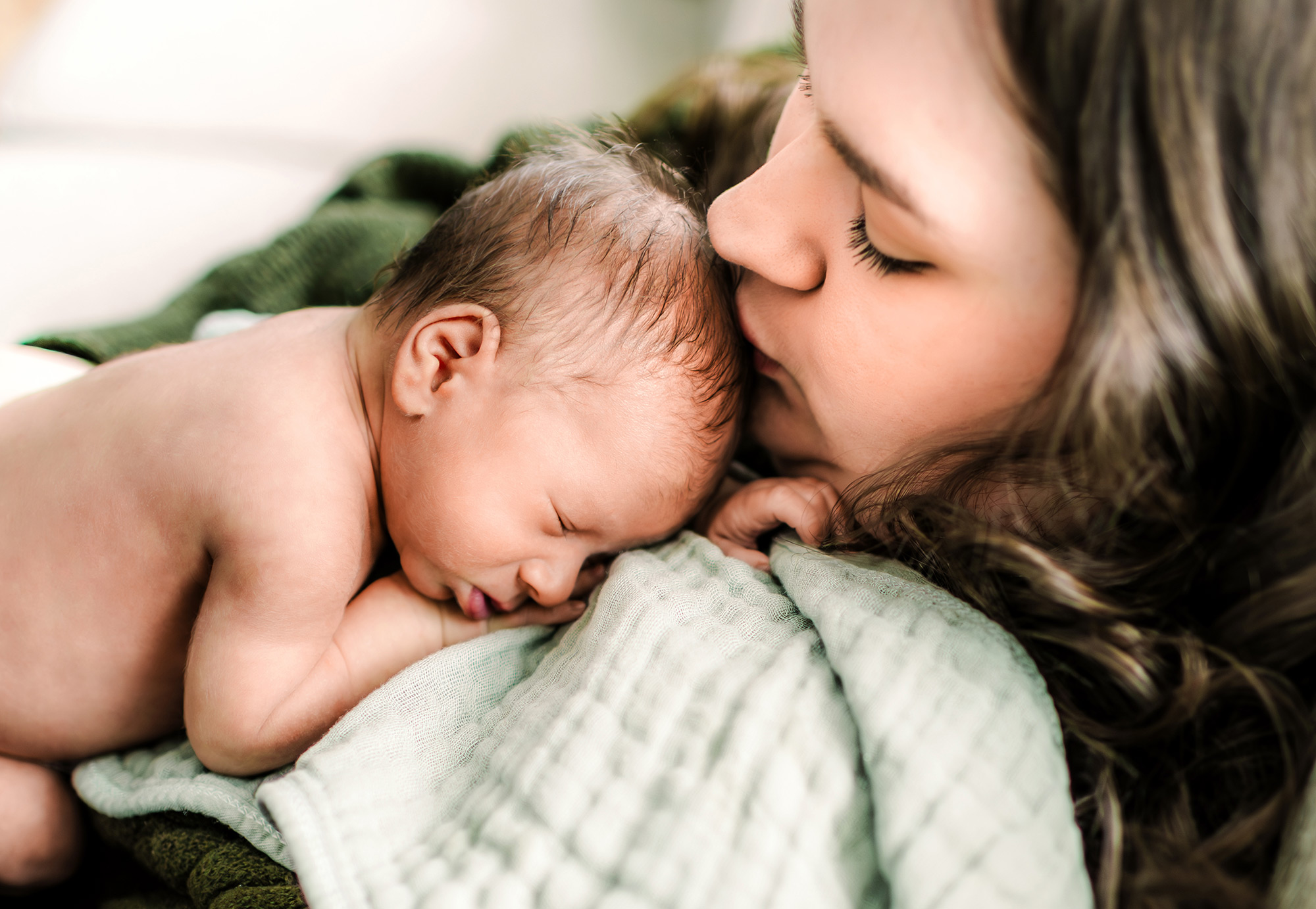 Newborn sleeping on mom's chest
