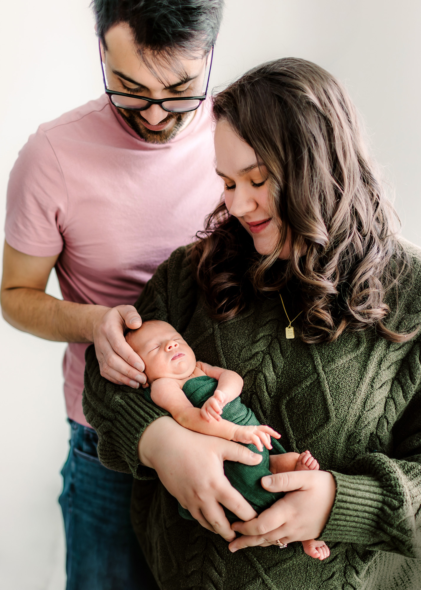 Mom and dad holding their newborn