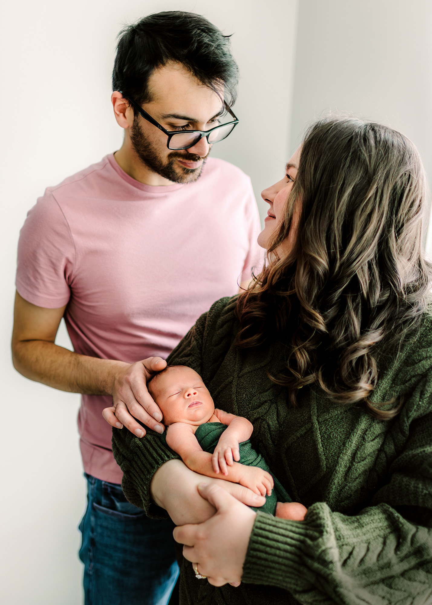 Mom and dad holding their newborn