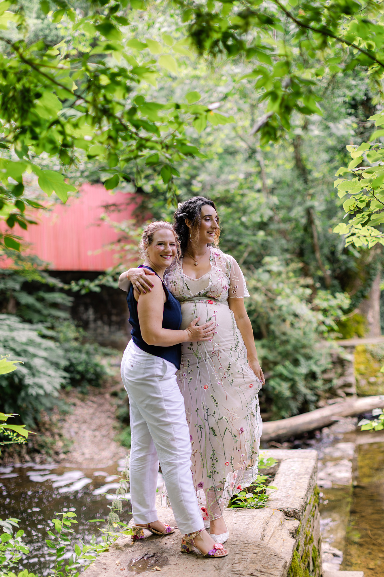 Two brides by Wissahickon Valley creek