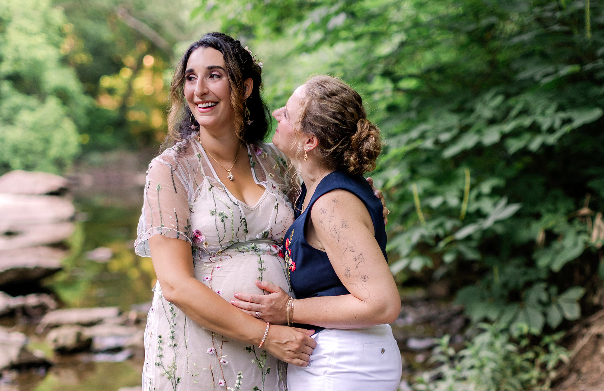 Two brides by Wissahickon Valley creek