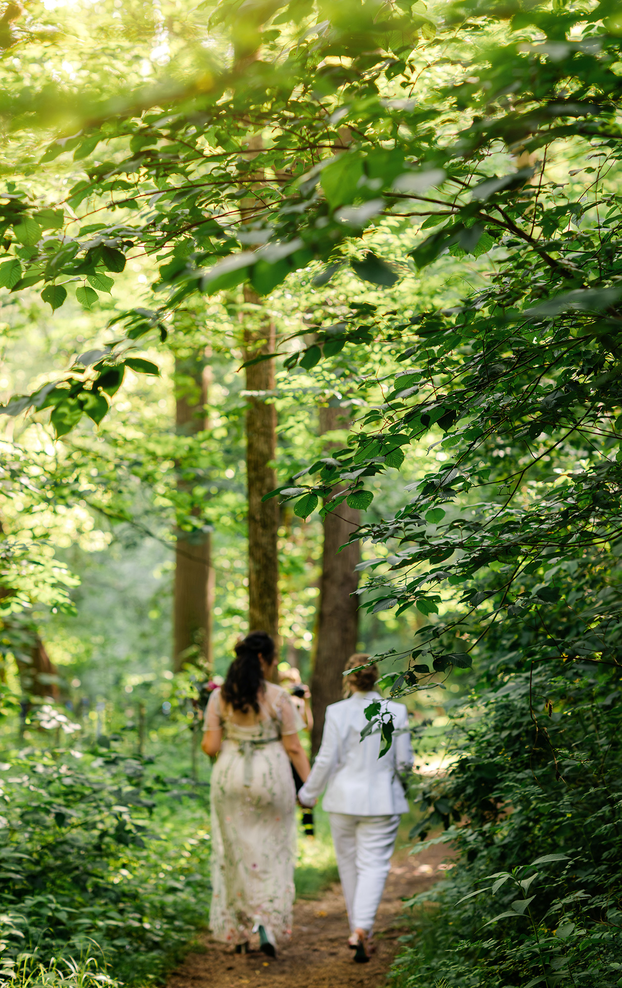 Two brides walking in Wissahickon Valley