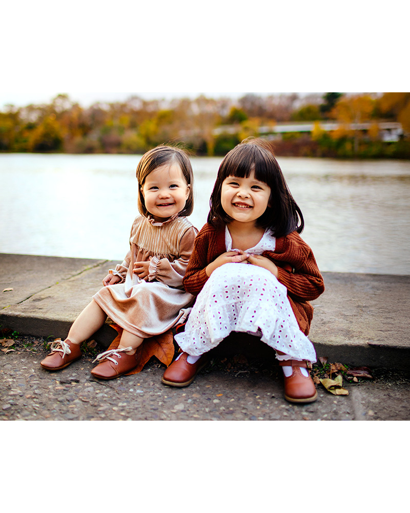 Two girls posing for a mini fall session on Kelly Drive