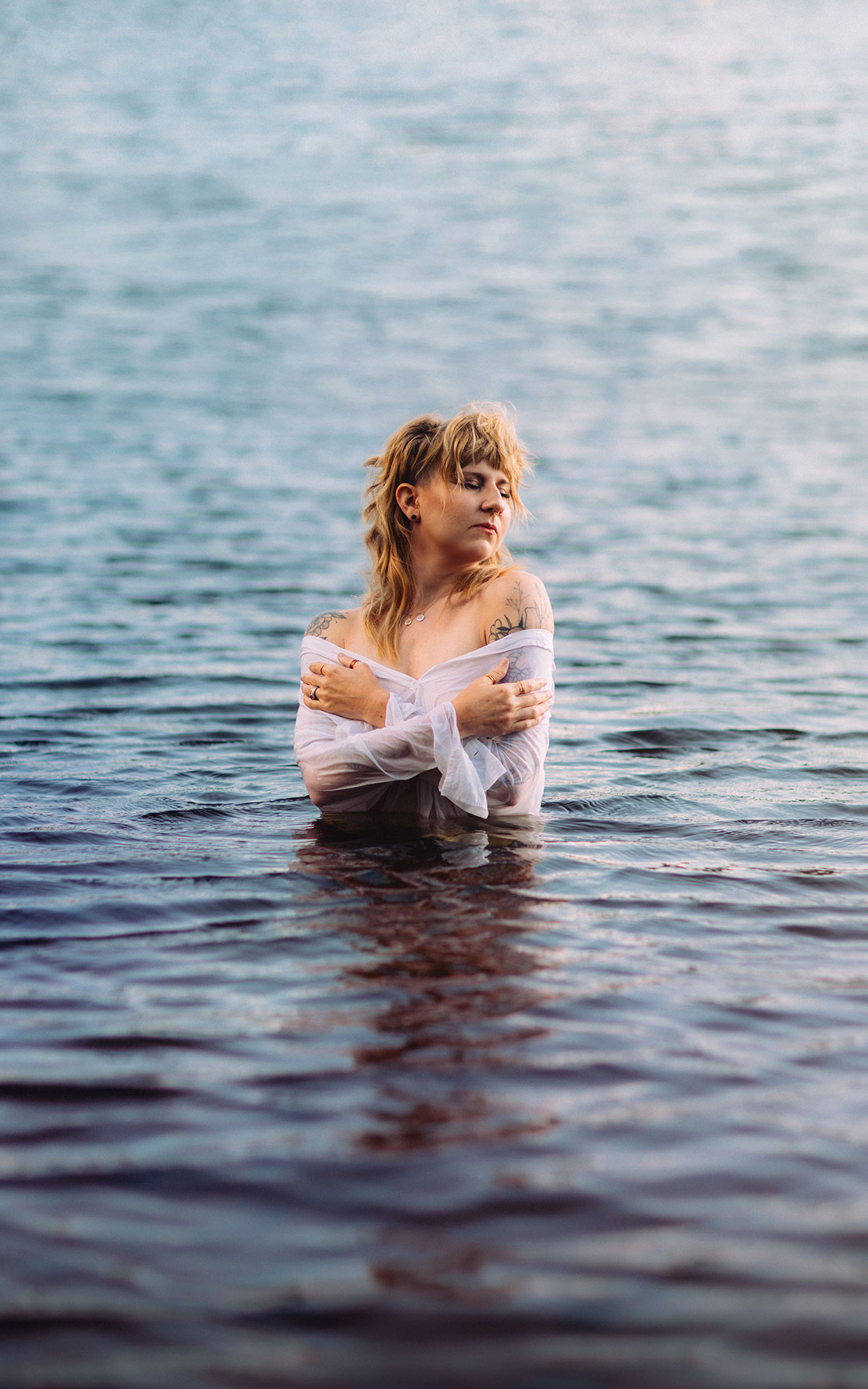 woman in a lake surrounded by water